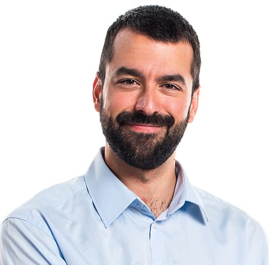 a smiling man with a beard, mustache, black hair, brown eyes, in a blue shirt